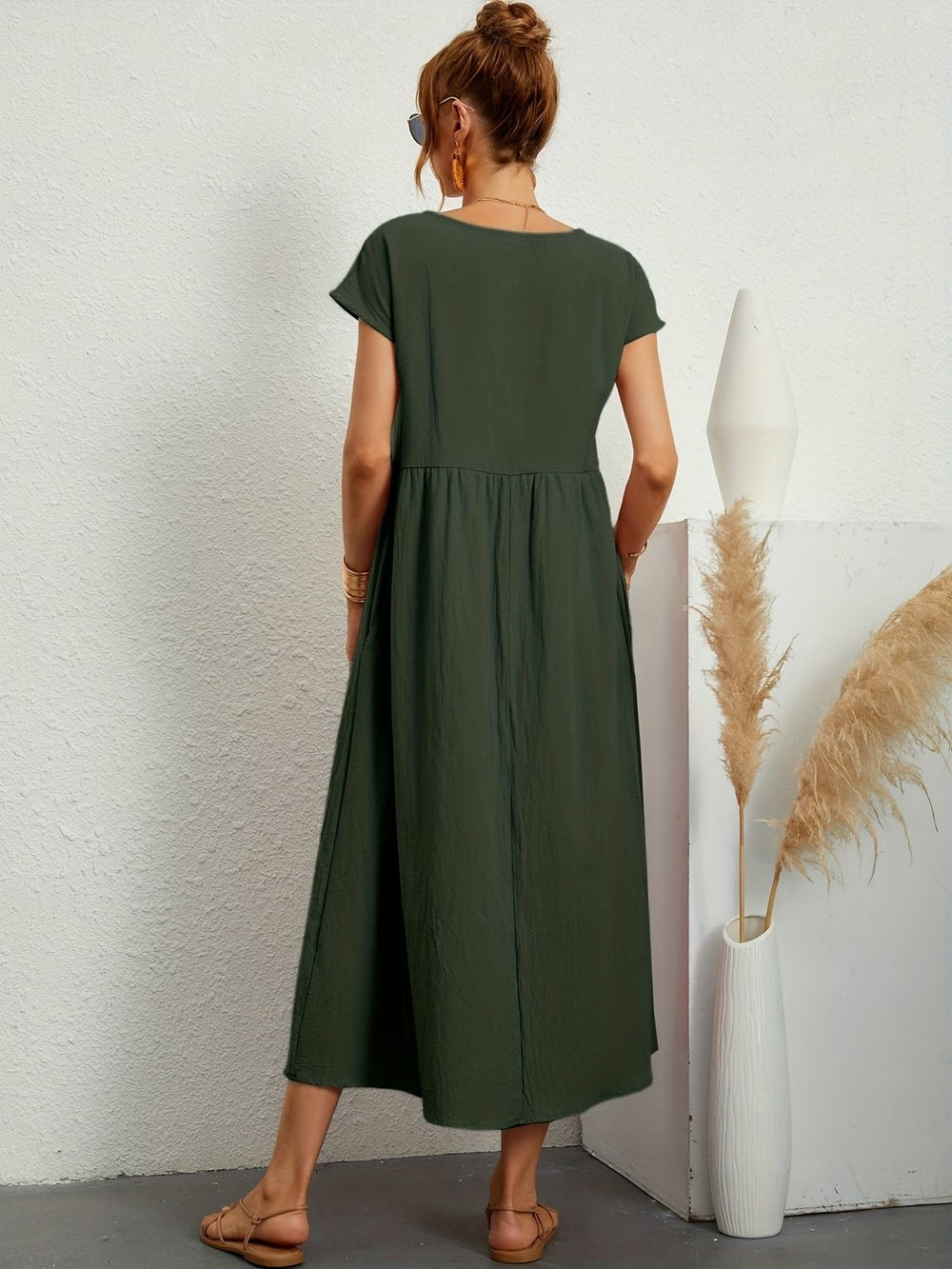 back view of olive green maxi dress showing relaxed A-line silhouette