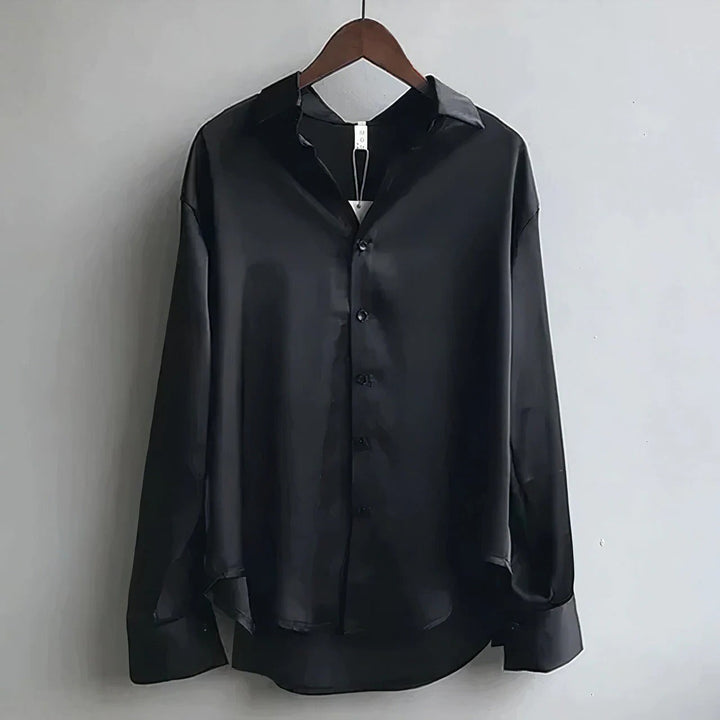 Black satin button-down shirt with collar on wooden hanger