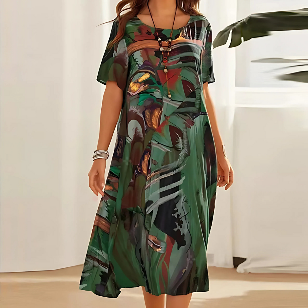 green abstract print midi dress with short sleeves and relaxed fit