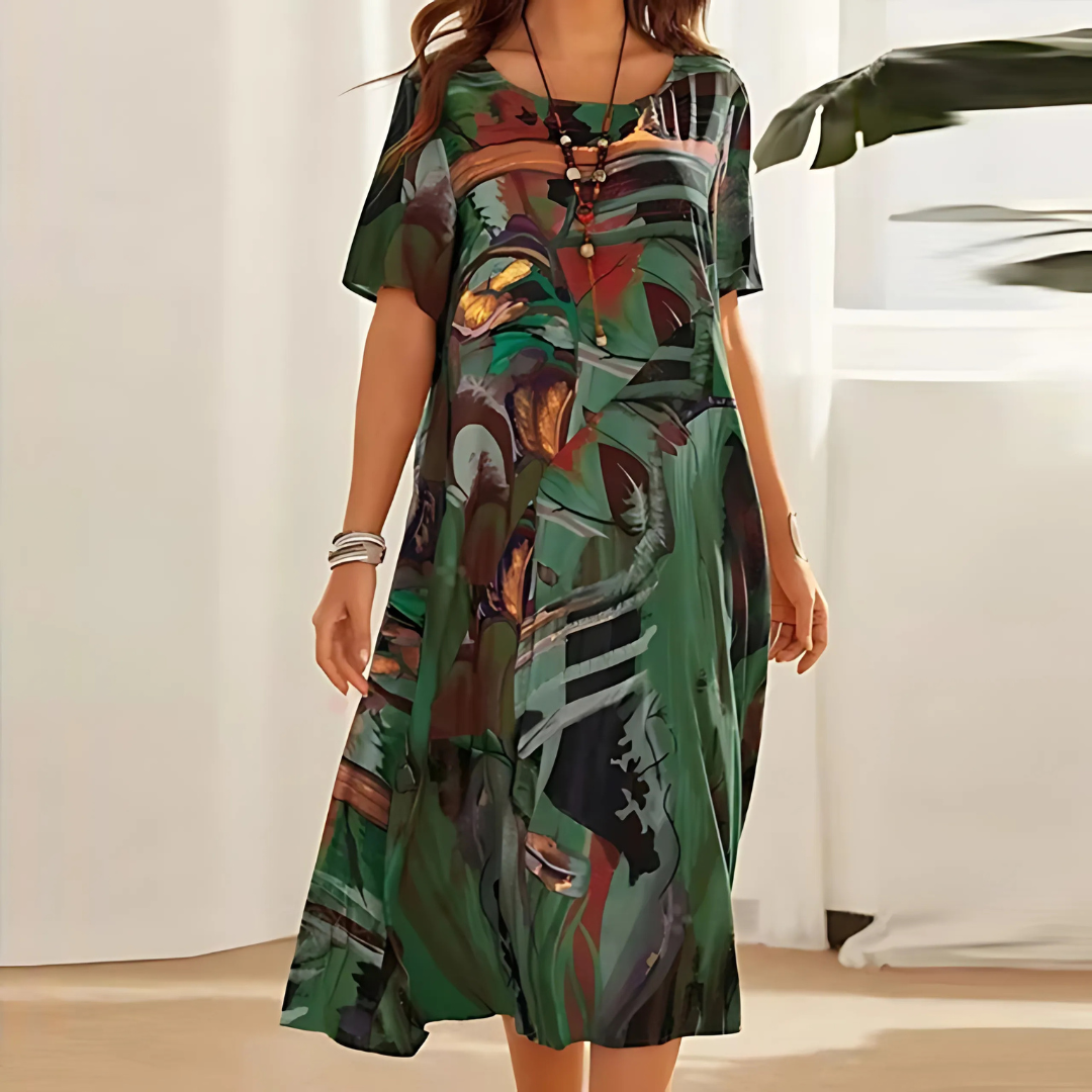 green abstract print midi dress with short sleeves and relaxed fit