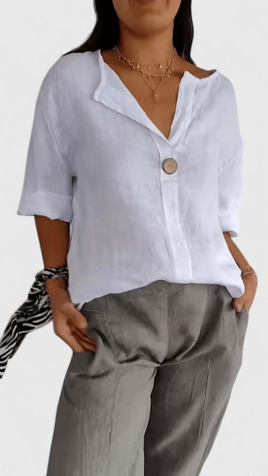 White linen-style blouse with notched collar and half sleeves