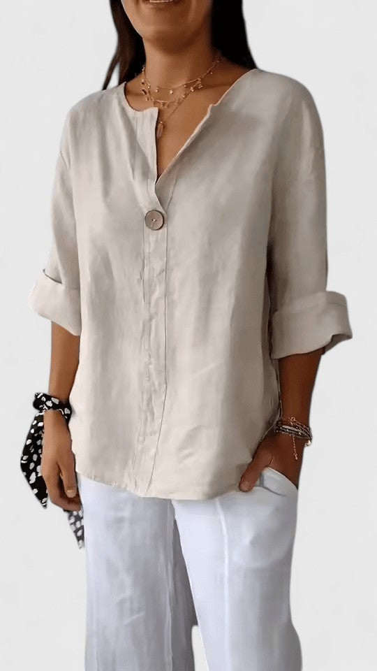 Beige V-neck blouse with rolled long sleeves and relaxed silhouette
