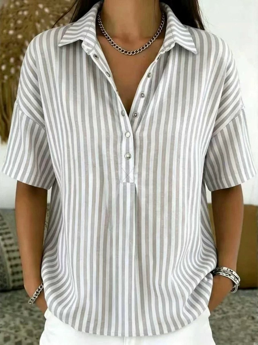 Gray and white striped blouse featuring collared half-button design
