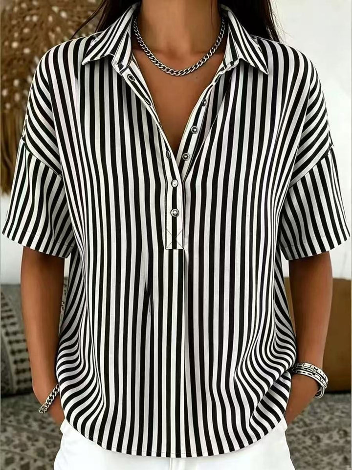 Black and white striped collared blouse with relaxed half-button front