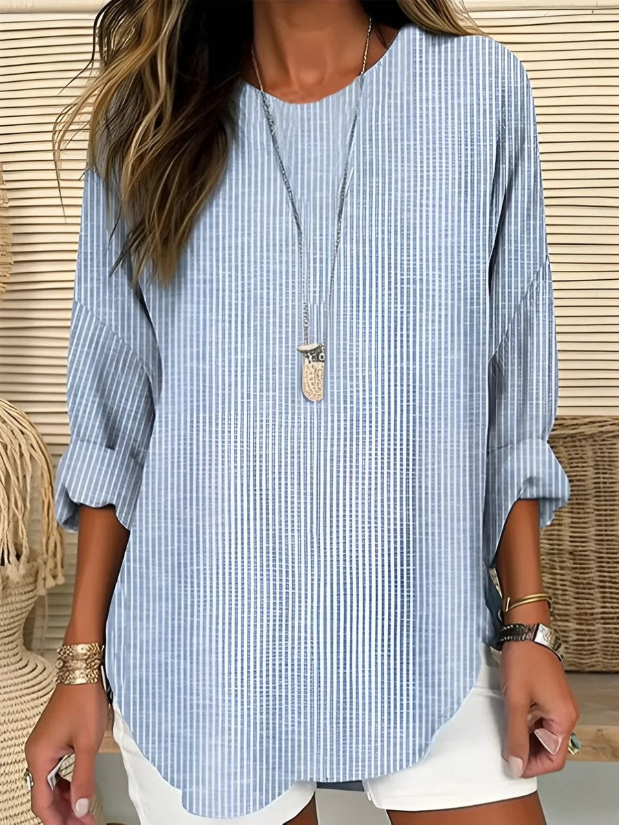 Blue and white striped long-sleeve blouse with relaxed crew neckline