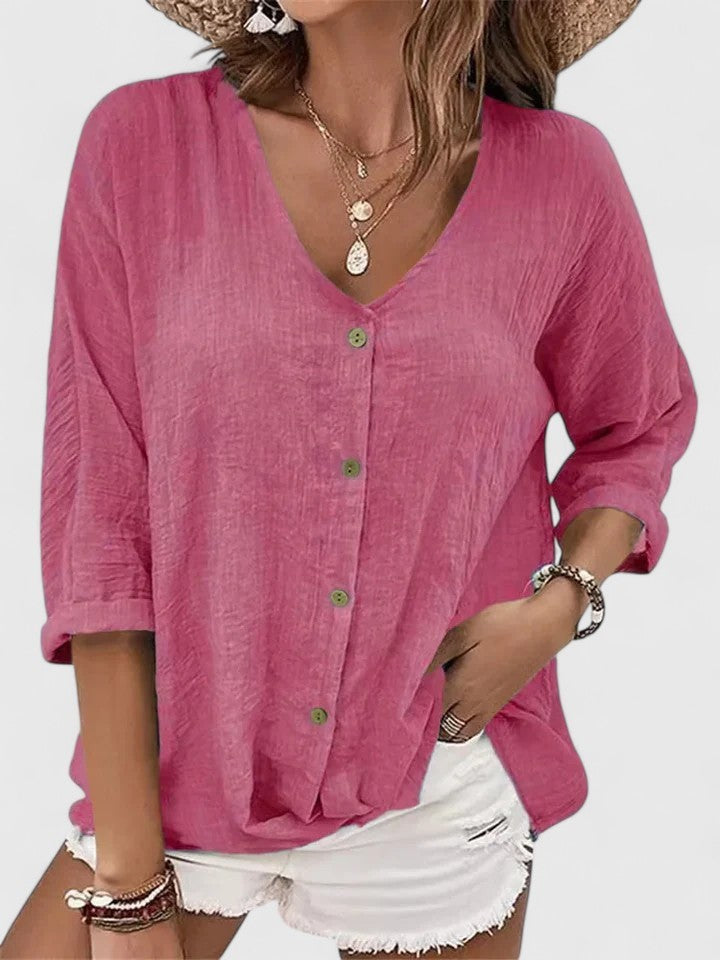 Pink button-front linen blouse featuring V-neck and oversized relaxed fit