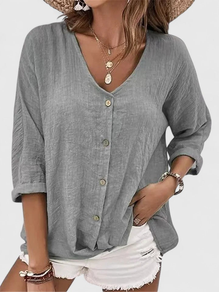 Gray linen button-up top with V-neck and rolled three-quarter sleeves