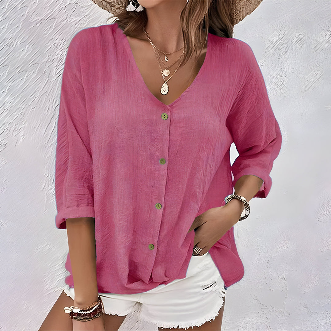 Rose pink textured button-up blouse with V-neck and contrast green buttons
