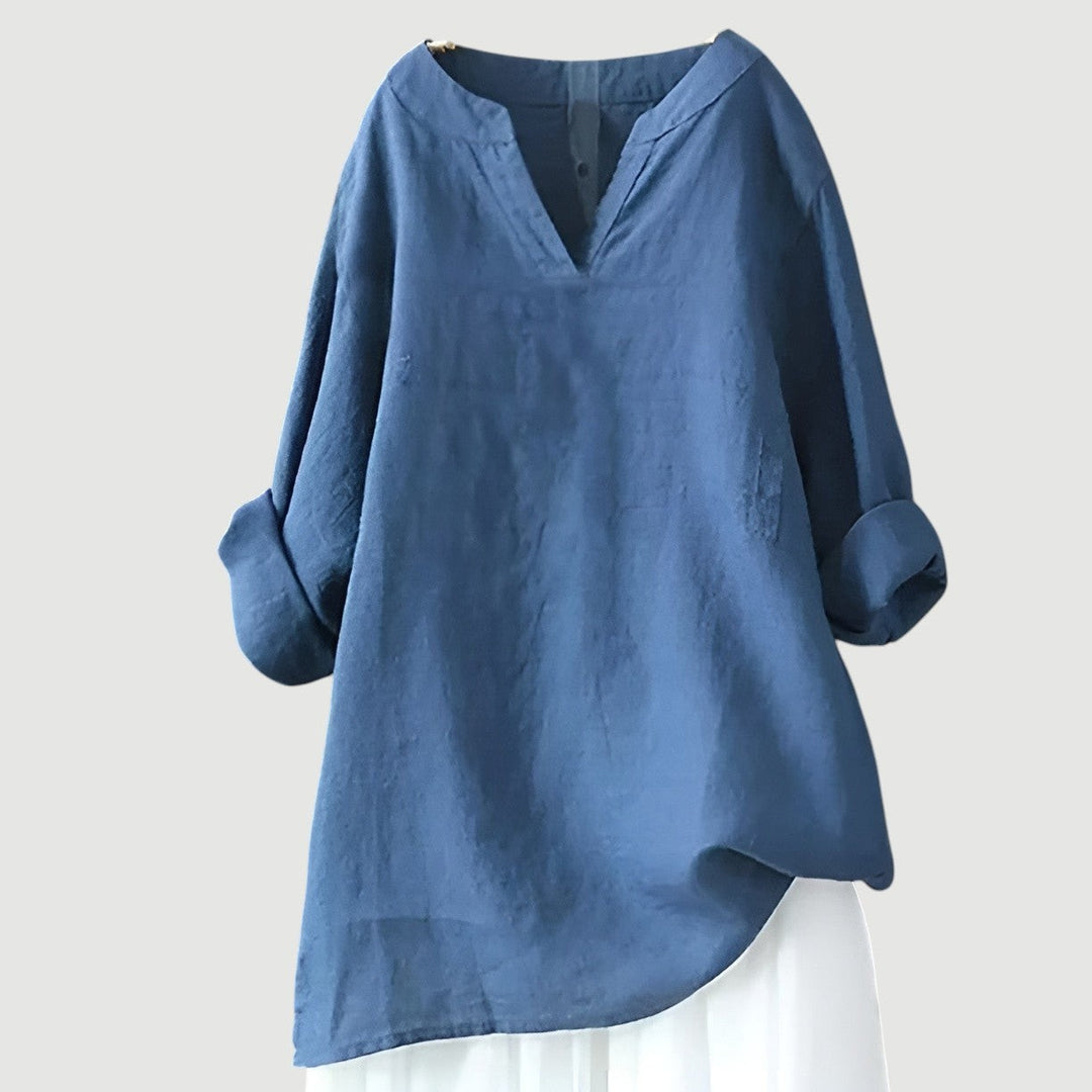 Blue linen tunic top with V-neckline and rolled long sleeves