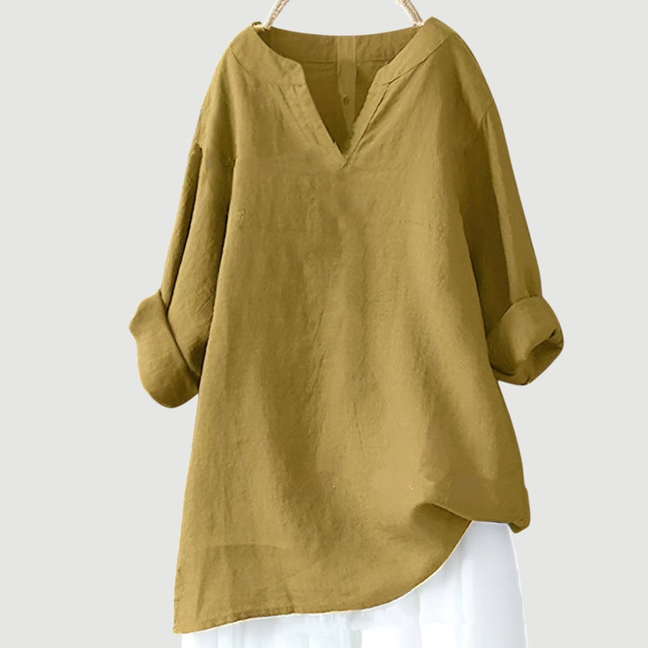 Mustard yellow linen top with relaxed fit and rolled cuffs