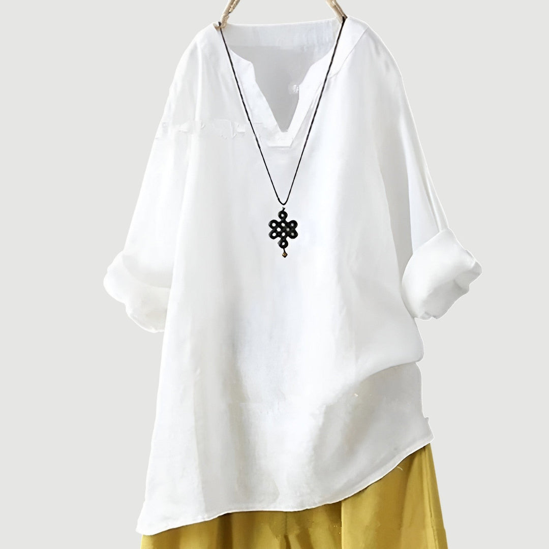White linen blouse with split neckline and oversized fit