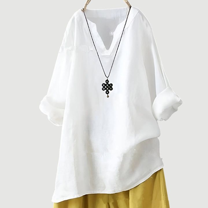 White linen blouse with split neckline and oversized fit