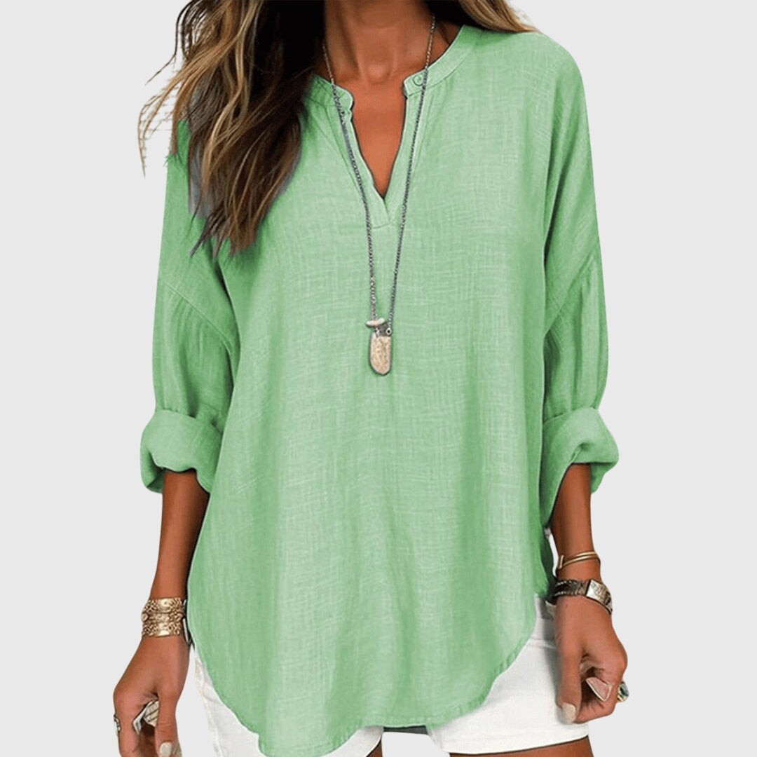 Sage green oversized blouse with curved hem and split neckline