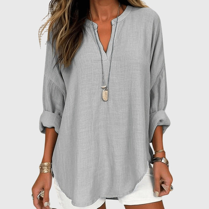 Light gray flowy blouse with mandarin collar and curved hem