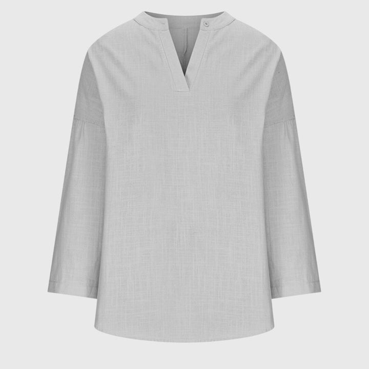 Light gray textured beach shirt with split collar, flat lay