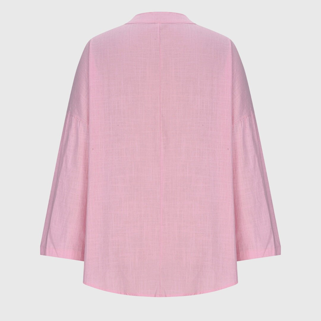Pink flowy beach shirt back view showing wide sleeves and curved hem