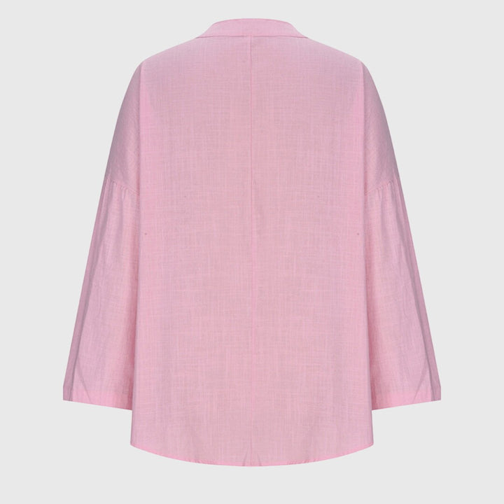 Pink flowy beach shirt back view showing wide sleeves and curved hem