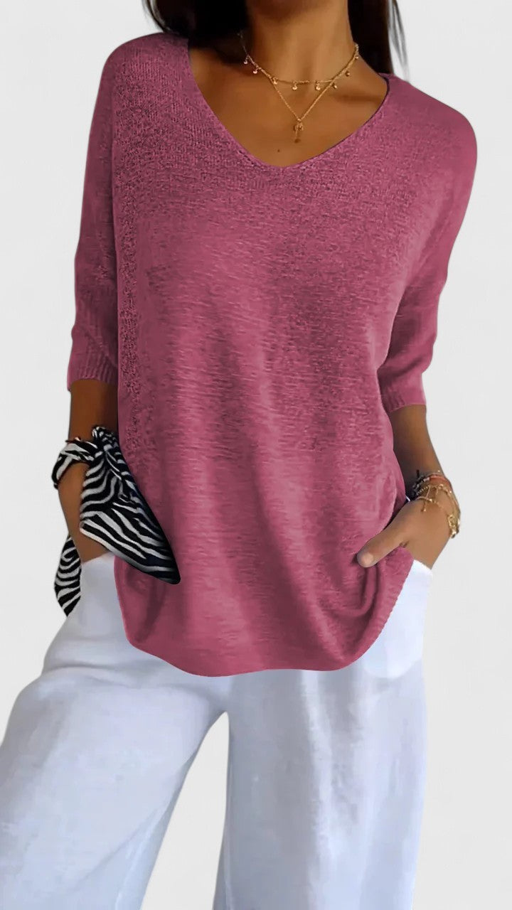 Mauve pink knit V-neck top with three-quarter sleeves, casual style