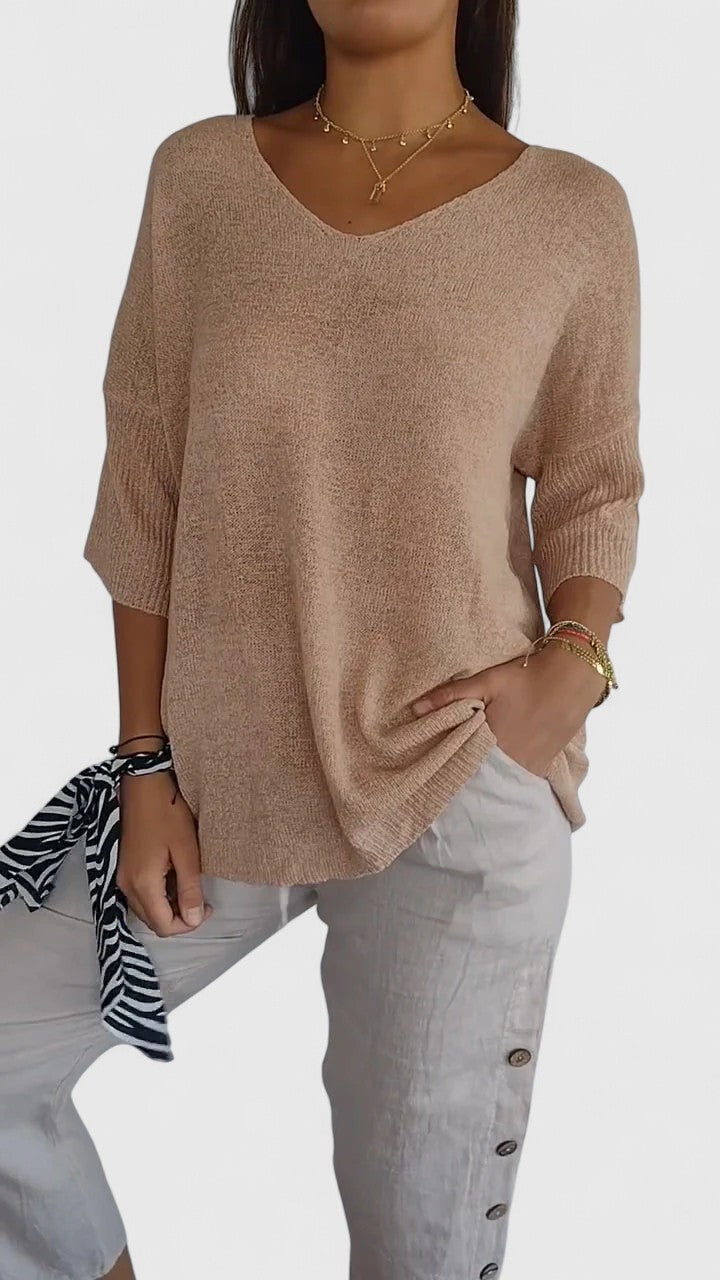 Beige V-neck knit top with three-quarter sleeves, casual oversized style