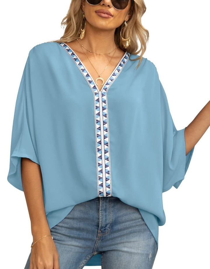 Sky blue relaxed tunic top with embroidered V-neck trim and half sleeves