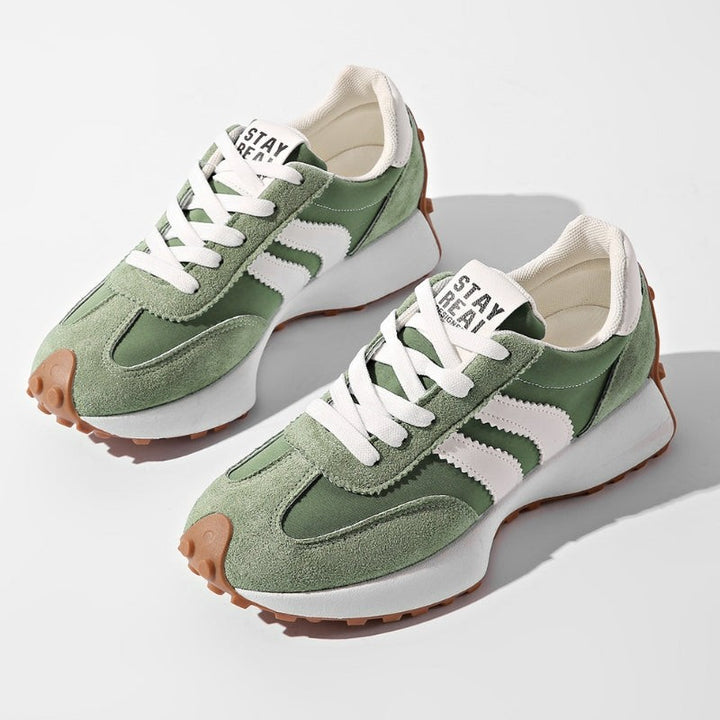 Sage green suede platform sneakers with white stripes and chunky rubber sole
