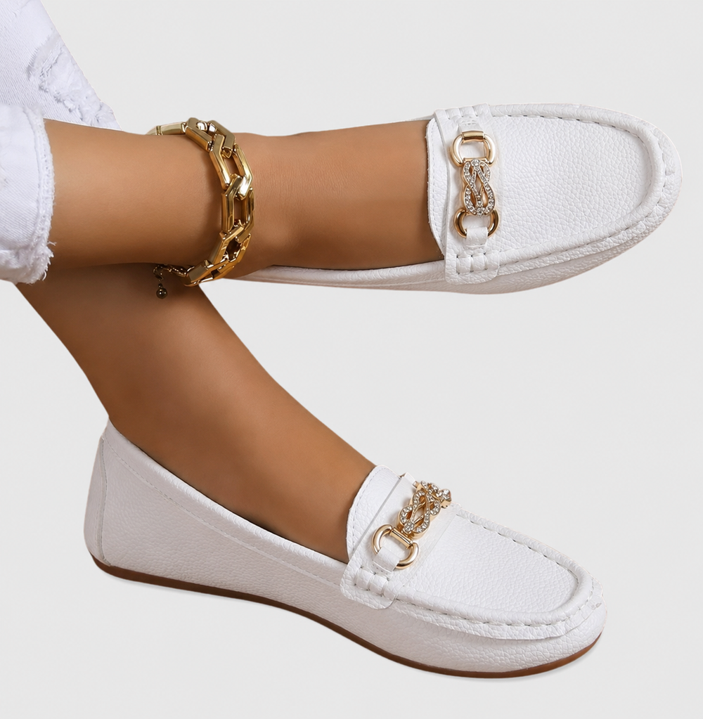 side view of white slip-on flat loafers with crystal chain trim