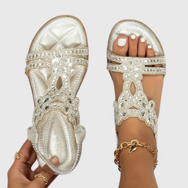 silver rhinestone flat sandal featuring sparkly floral cutout strap
