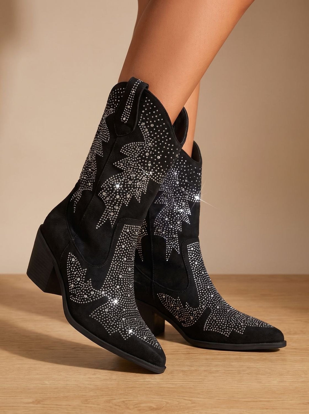 Diamante-studded western boots worn on model, highlighting block heel and pull tabs