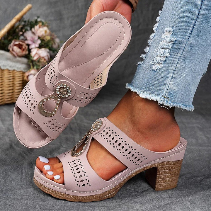 pink block heel sandals with cutout straps and jeweled buckle