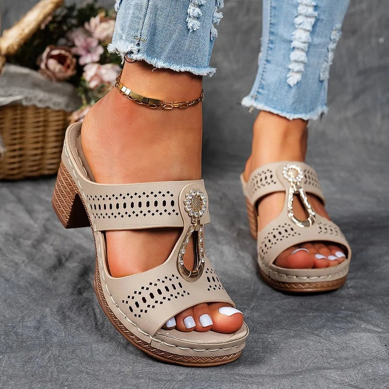 beige perforated wedge sandals featuring embellished T-strap accent