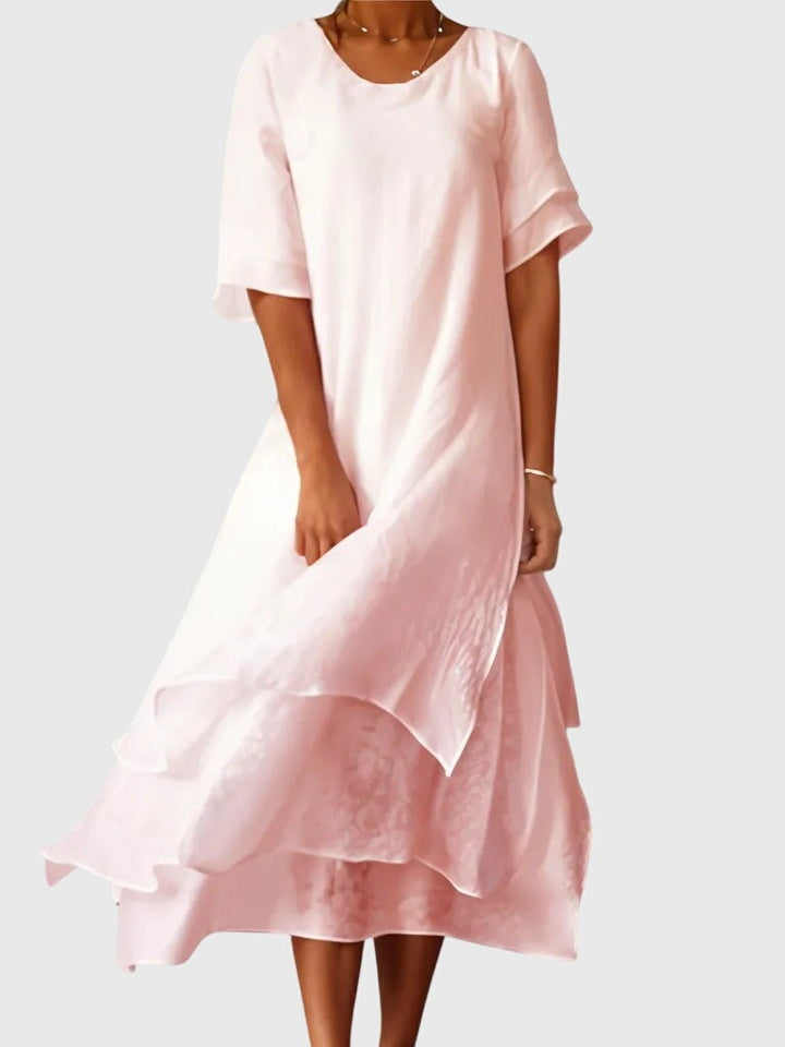 blush pink tiered maxi dress with ruffled hem and short sleeves