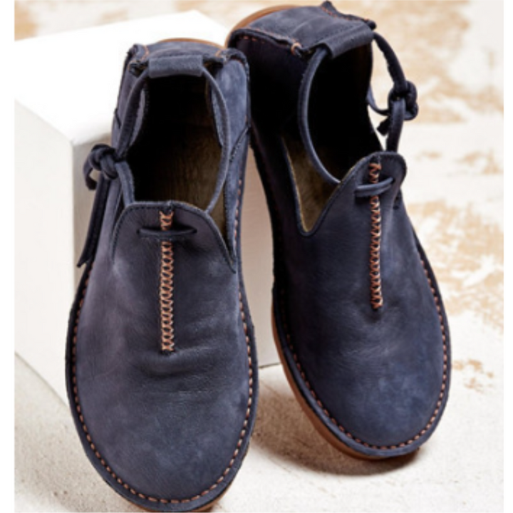 Navy blue leather flat shoes with stitched detail and lace-up ankle tie