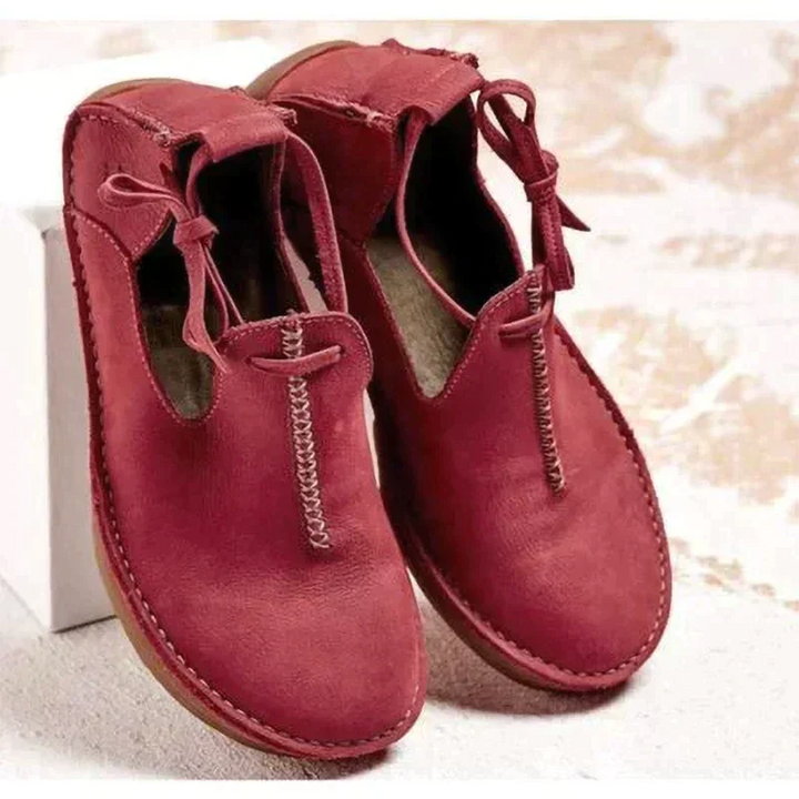 Burgundy leather flat shoes with braided stitching and lace-up ankle strap