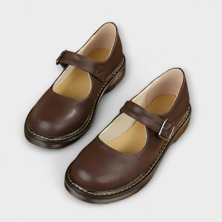 brown leather Mary Jane shoes with buckle strap and stitched sole