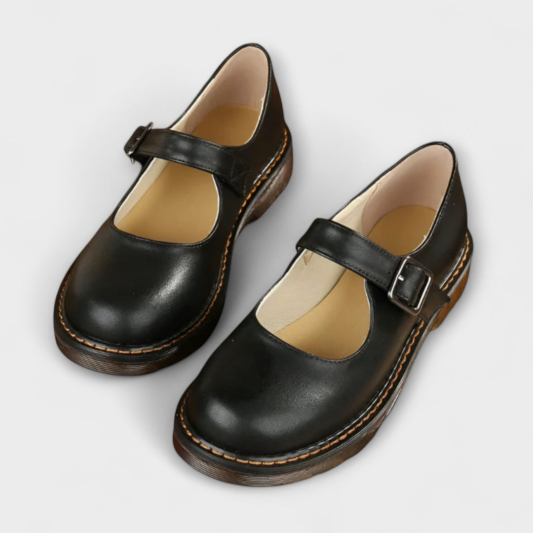 black leather Mary Jane shoes with silver buckle and chunky sole