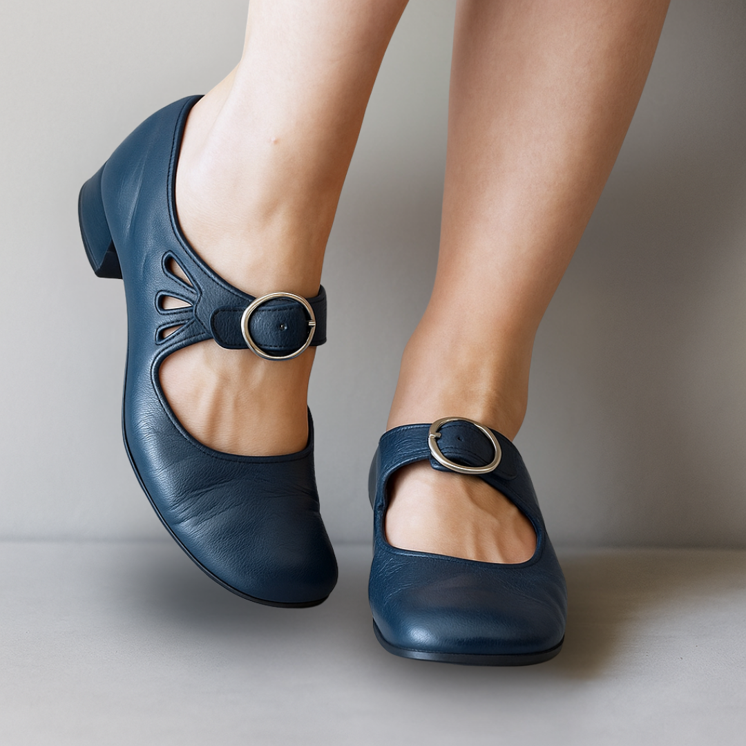Navy leather Mary Jane flats with cutout detailing and buckle strap