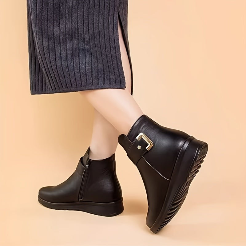 woman wearing black ankle boots with buckle detail and ribbed knit skirt