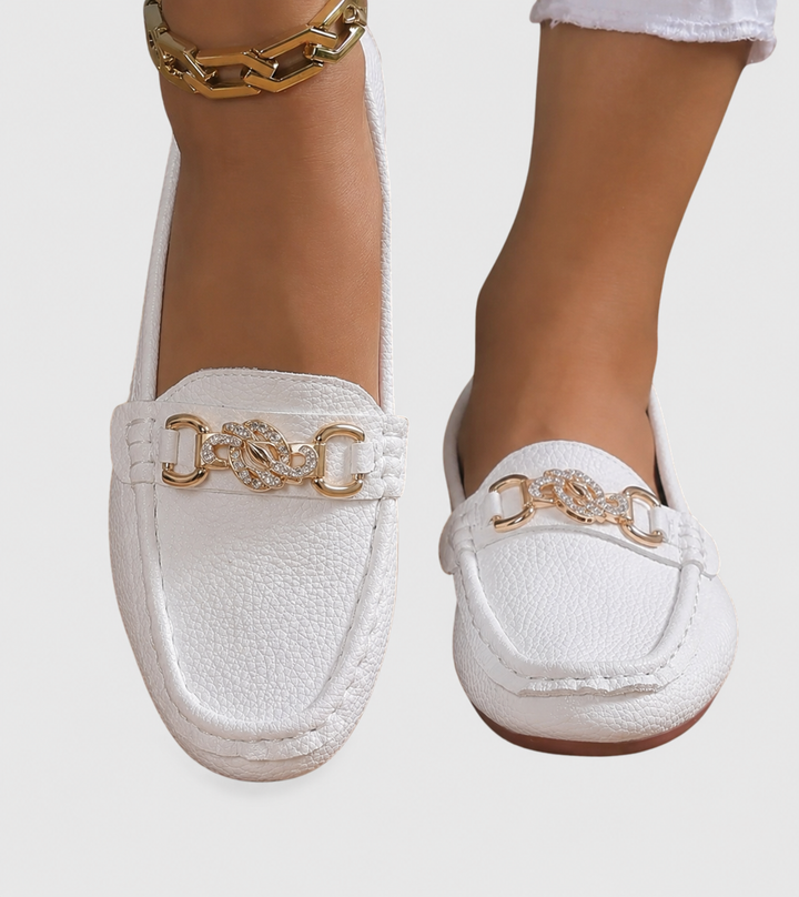 white leather loafer flats with sparkly gold chain buckle accent