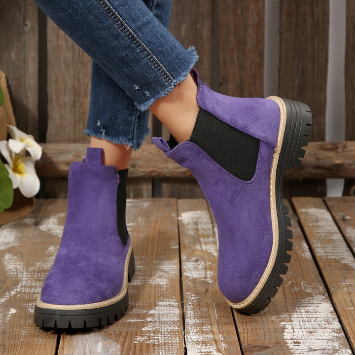 Purple suede Chelsea boots with black elastic insert and chunky sole