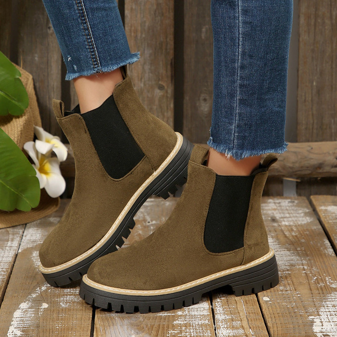 Khaki suede Chelsea boots with contrast stitching and rugged tractor sole