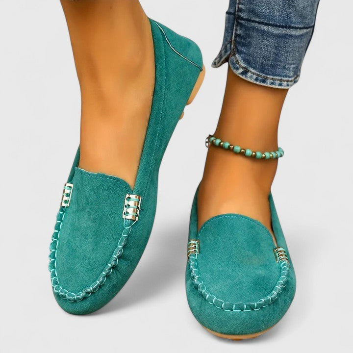 Teal suede moccasin loafer with stitched trim and gold hardware detail
