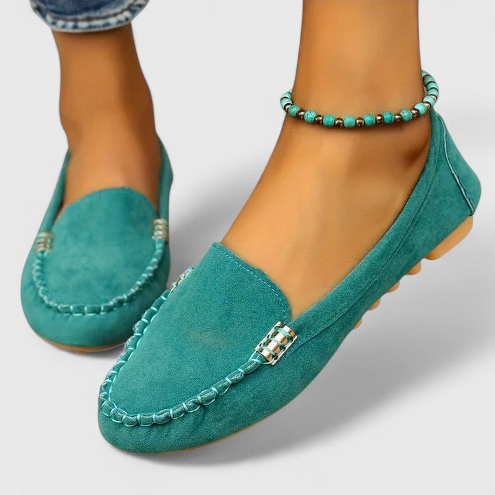 Turquoise suede moccasin flat with contrast stitching and metallic trim