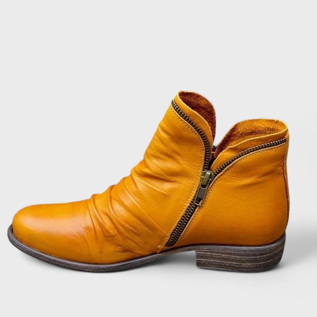 Mustard yellow leather ankle boot with ruched front and side zip