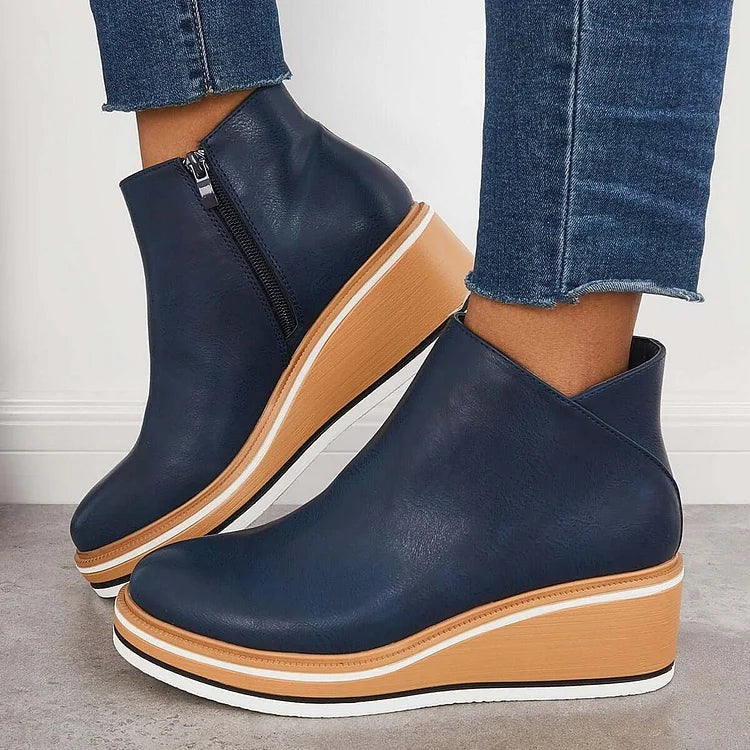 Navy blue leather ankle boots with side zipper and platform wedge sole