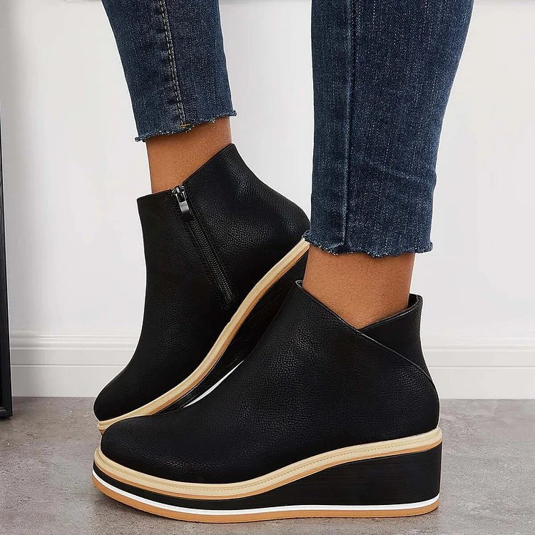 Black pebbled leather ankle boots with silver side zip and wedge sole