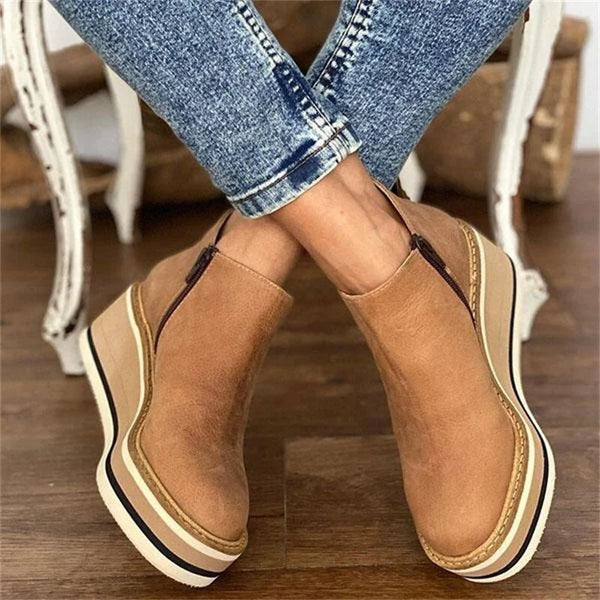 tan leather zip-up wedge booties with contrast striped platform sole