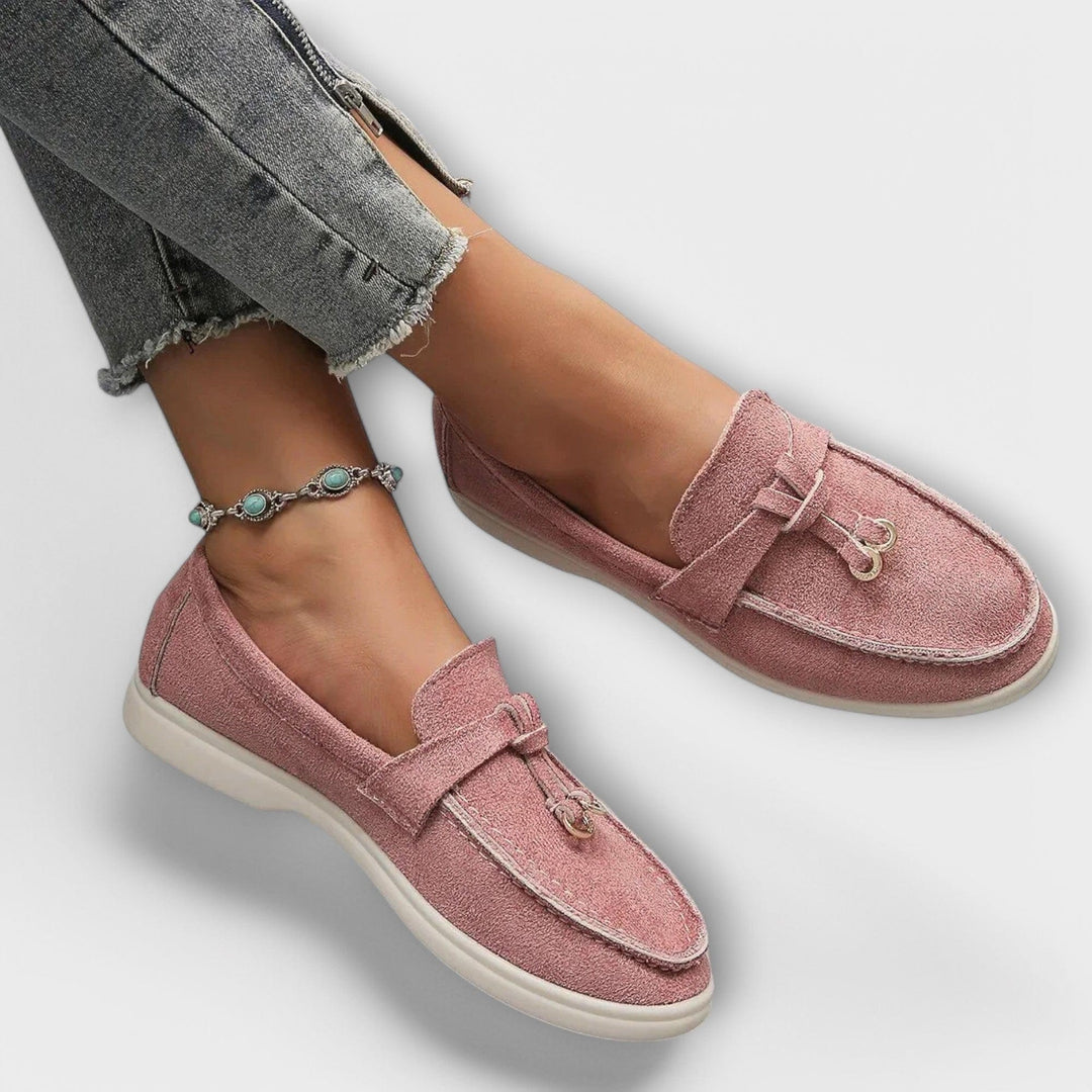 Dusty pink suede loafers with knotted tassel detail and white sole