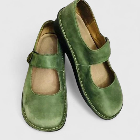 Green leather Mary Jane orthopedic shoes with button strap and stitched sole