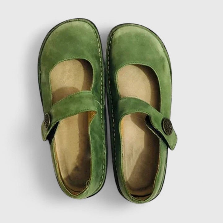Top view of green leather Mary Jane orthopedic shoes with button closure