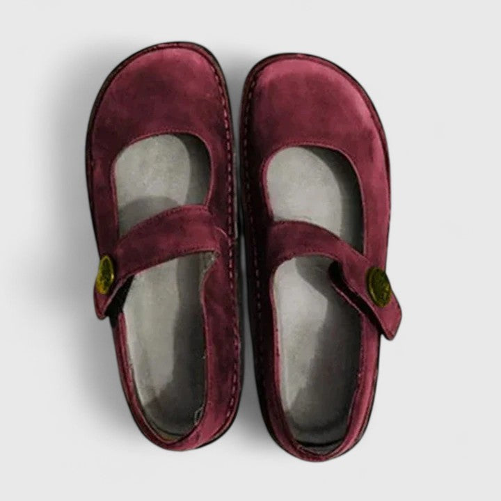 Top view of burgundy suede Mary Jane orthopedic shoes with button strap